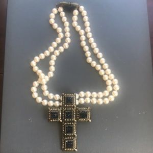 Heidi Daus pearl and rhinestone cross necklace.